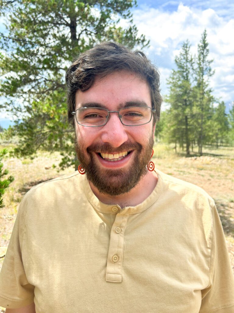 Amos smiling outside